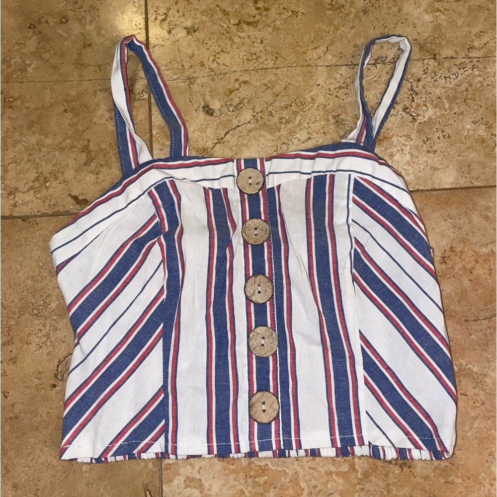 Cage Size small. White Blue and Red striped (blue and red are more muted).